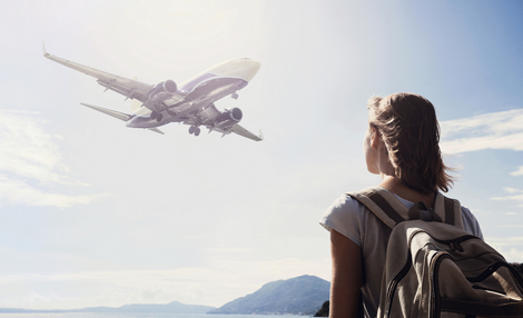 Student looking at aircraft in the sky.png