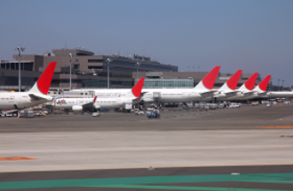 Several aircraft parked on runway