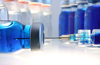 Vaccine bottles with syringe